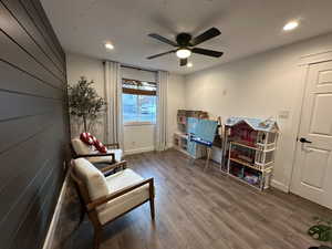 Sitting room featuring hardwood / wood-style flooring, recessed lighting, and a ceiling fan