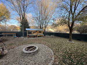 View of yard featuring exterior structure and an outbuilding