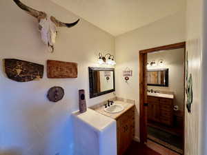 Bathroom featuring two vanities