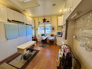 Kitchen featuring white cabinetry and recessed lighting