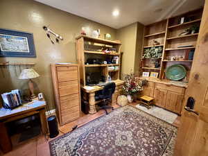 Office area with light tile patterned flooring