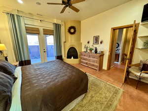 Bedroom featuring french doors, access to outside, and ceiling fan