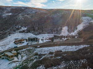 Aerial overview of property's location with a mountainous background