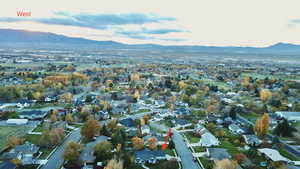 Aerial perspective of suburban area featuring a mountain backdrop