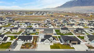Expansive aerial view of the surrounding community with mountain and valley views all around. A great look at the peaceful neighborhood setting.