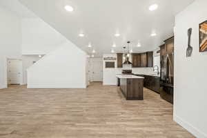 Beautiful open concept design showcasing the large kitchen, spacious living area, and clean modern finishes throughout.