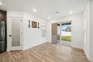 Bright dining space with sliding glass doors to the backyard. Great natural light and easy access for indoor/outdoor dining.