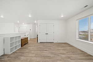 Another angle of the loft showcasing the double-door closet and great flow to the hallway and bedrooms.