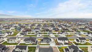 Aerial view showcasing the well-kept neighborhood with quiet streets, newer homes, and convenient proximity to local amenities.