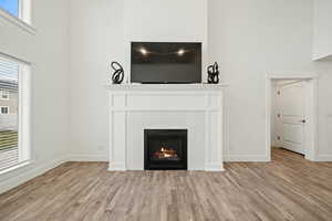 Beautiful floor-to-ceiling fireplace with custom trim and tile surround. A stylish focal point that adds warmth and charm to the main living space.