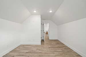 Spacious flex room with recessed lighting and durable flooring. Perfect for a home office, craft room, workout space, or extra storage.