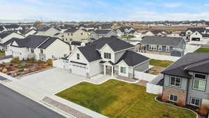 Drone angle highlighting the backyard space, privacy fencing, outbuilding, and the home’s layout. Plenty of room for outdoor living and future customization.