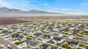 Stunning aerial photo capturing the neighborhood and sweeping mountain views. Beautiful setting with a peaceful community feel.