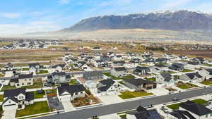 Stunning aerial view capturing the home in relation to the nearby mountain range. Gorgeous natural surroundings and open space around the community.