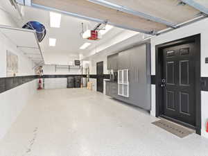 Garage featuring a garage door opener