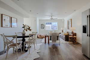 Dining area featuring wood finished floors and ceiling fan