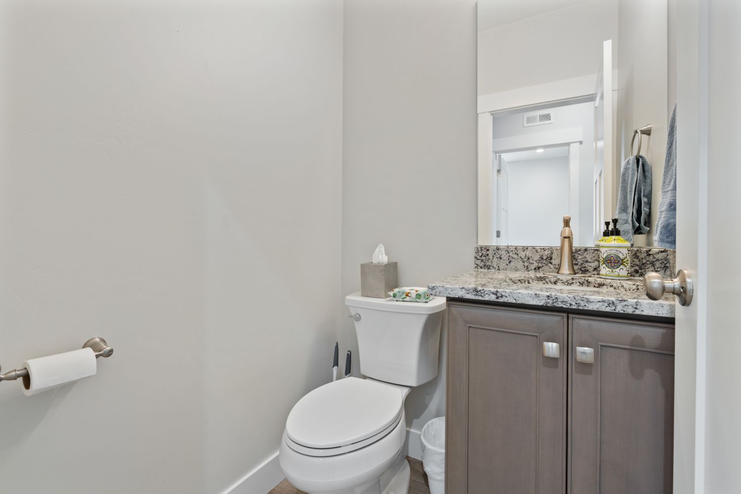 Half bath featuring vanity and toilet