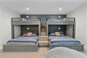 Carpeted bedroom with baseboards