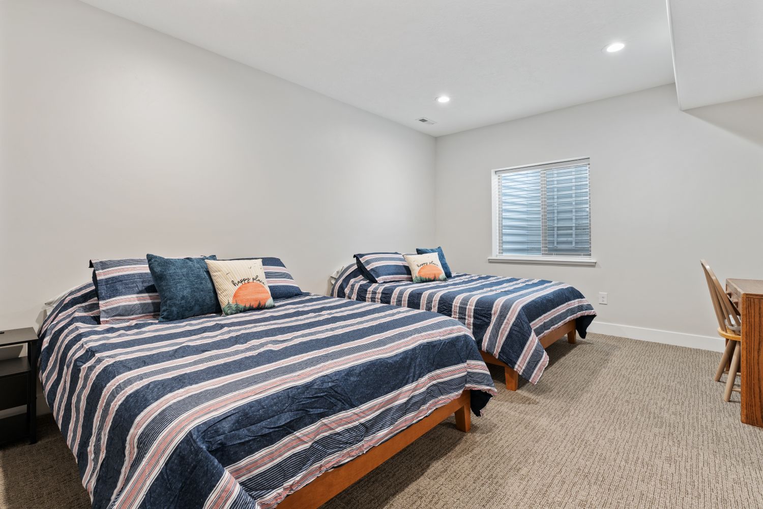 Bedroom with light carpet and recessed lighting