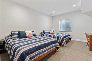 Bedroom with light carpet and recessed lighting