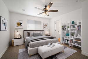 Carpeted bedroom featuring ceiling fan and baseboards
