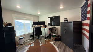 Office area with wood finished floors and baseboards