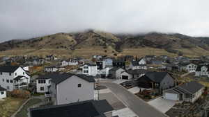 View of mountain background featuring nearby suburban area