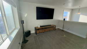 Living area with carpet floors and baseboards