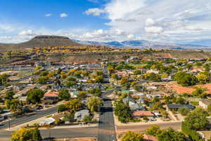 Aerial perspective of suburban area with a mountainous background