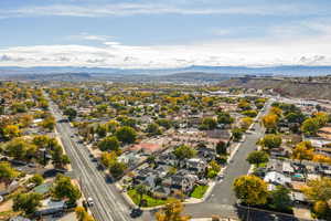 Aerial perspective of suburban area featuring a mountain backdrop