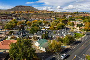 Aerial view of residential area featuring a mountainous background