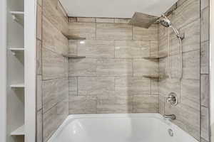 Bathroom featuring shower / washtub combination