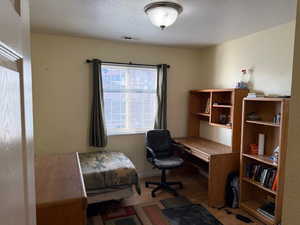 Office area with a textured ceiling