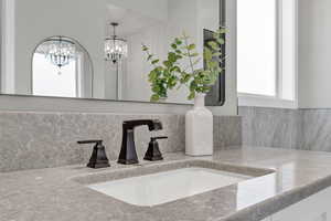 Bathroom view of vanity and backsplash