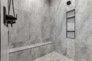 Full bathroom featuring a marble finish shower
