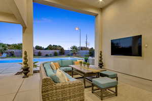 Fenced backyard with a patio and an outdoor hangout area
