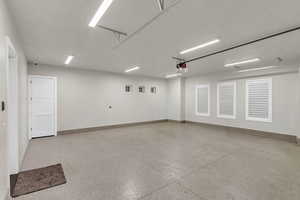 Garage featuring baseboards