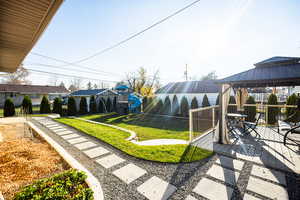 View of yard with a gazebo and outdoor dining area