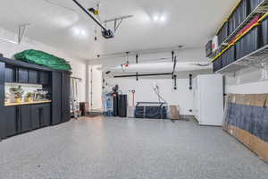 Amazingly spacious garage equipped with storage racks and shelving at your convenience!