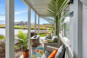 Large front porch perfect for outdoor furniture to relax and enjoy the lake view