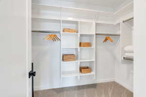 This closet features bright open design with ample storage & hanging space.