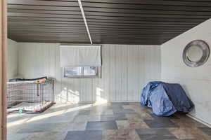 Bedroom with wood walls