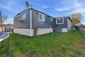 View of property exterior with a trampoline and cooling unit