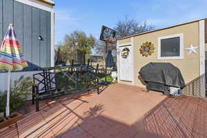 View of patio featuring a trampoline and area for grilling