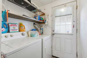 Laundry area featuring washer and clothes dryer