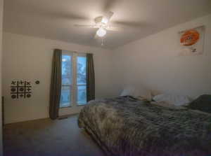 Bedroom with carpet floors and a ceiling fan