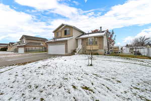 View of front of house featuring brick siding, a garage, and concrete driveway