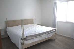 Bedroom with carpet flooring and a ceiling fan