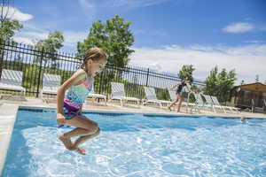 Community pool with a patio area
