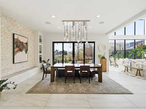 Dining room featuring built in shelves and recessed lighting